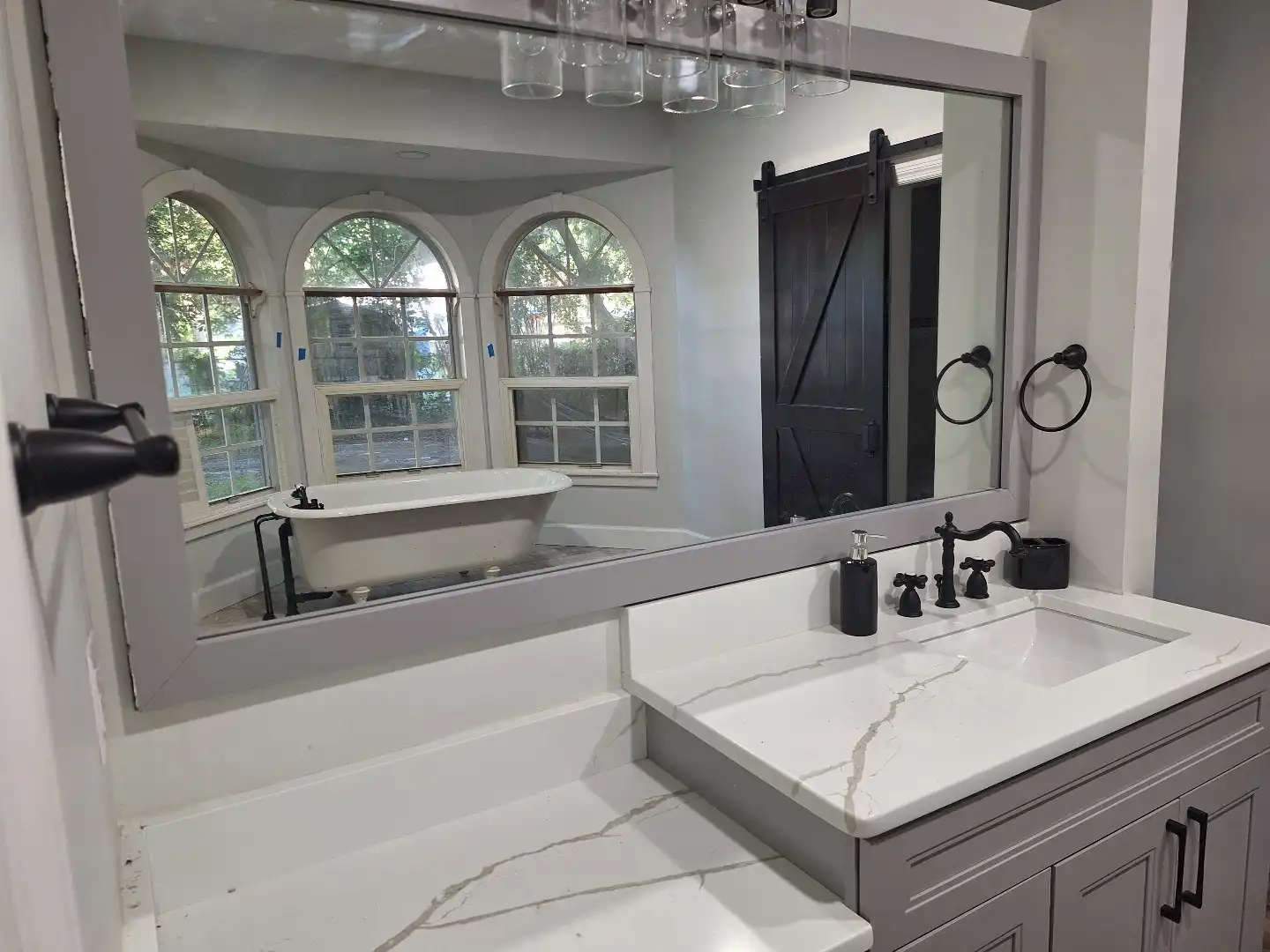 Modern bathroom vanity with barn door in Lakeland, FL
