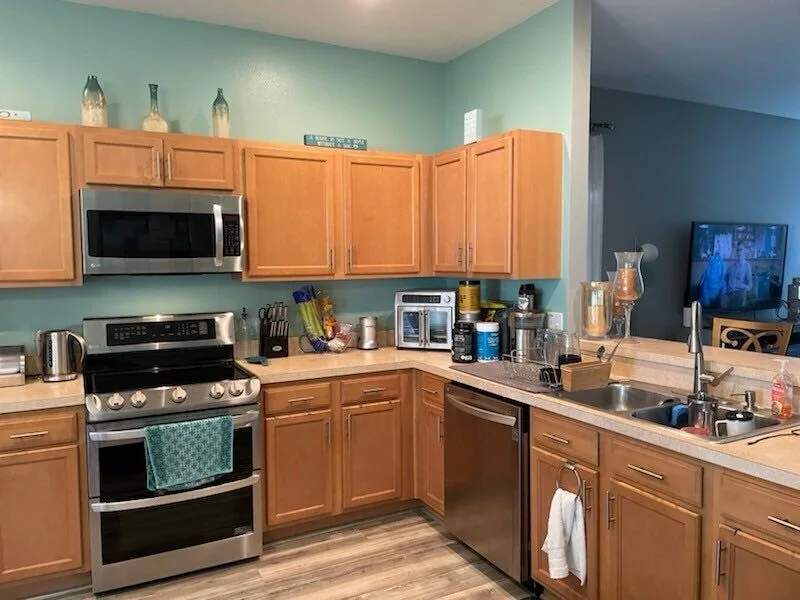 Kitchen before remodel in Lakeland, FL — dated cabinets and layout
